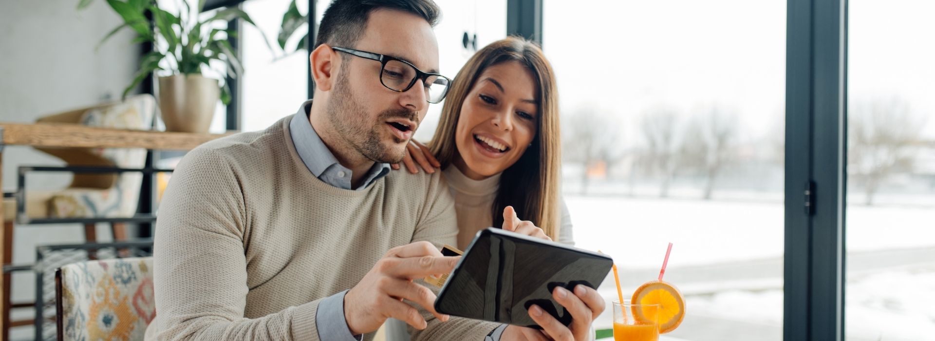 Happy Couple considering financial decisions